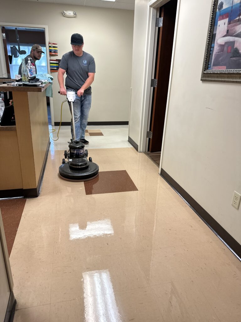 Midsouth Cleaning technician performing floor waxing and buffing service