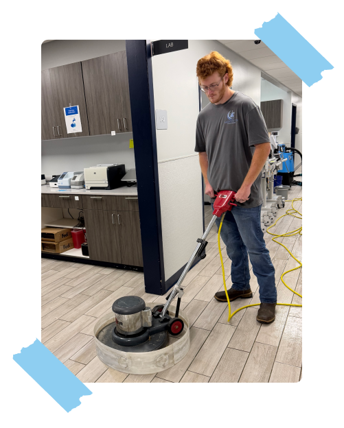 Midsouth Cleaning technician using professional floor polishing machine in a commercial facility lab.